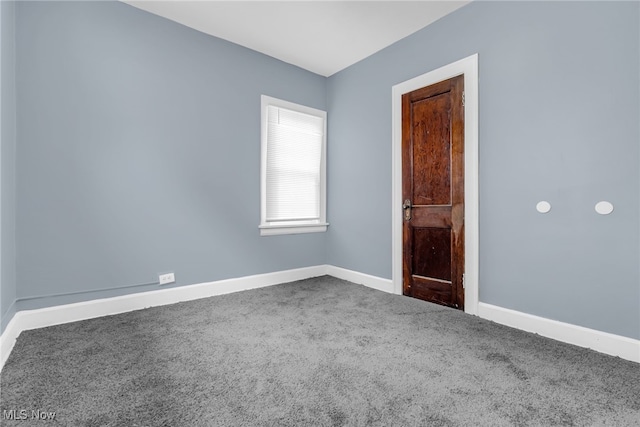 spare room featuring carpet floors