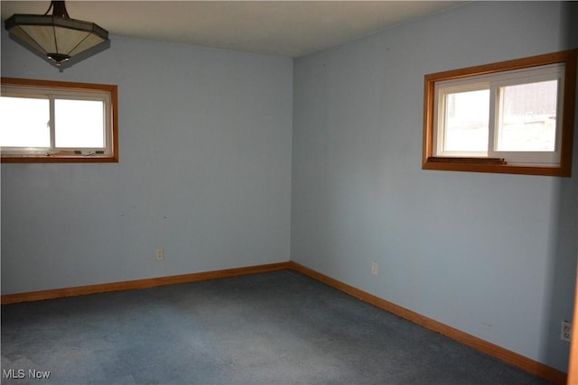 unfurnished room with carpet floors