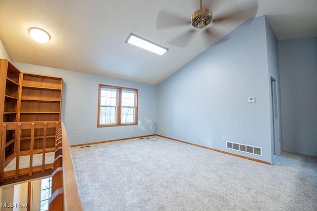 interior space featuring lofted ceiling and carpet flooring