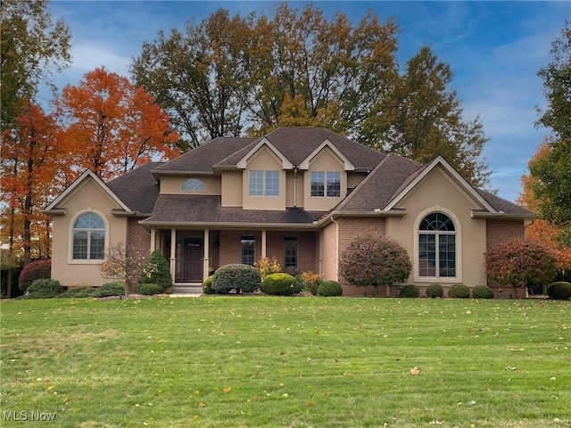 view of front property featuring a porch and a front lawn