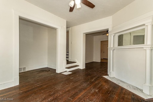 empty room featuring dark hardwood / wood-style flooring and ceiling fan