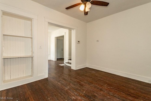 unfurnished room with ceiling fan and dark hardwood / wood-style floors