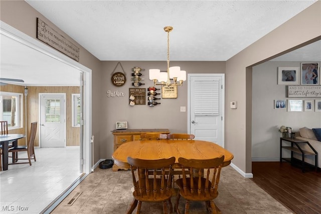 dining space featuring a chandelier and hardwood / wood-style floors