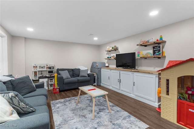 living room with dark hardwood / wood-style floors