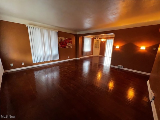 unfurnished room with hardwood / wood-style flooring