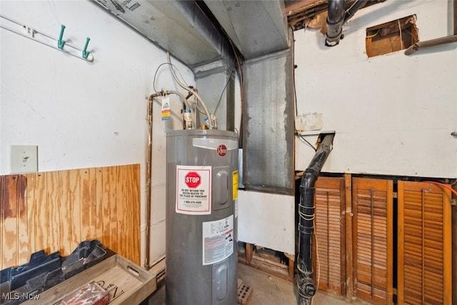 utility room featuring water heater