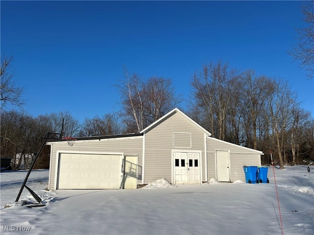 view of snow covered garage