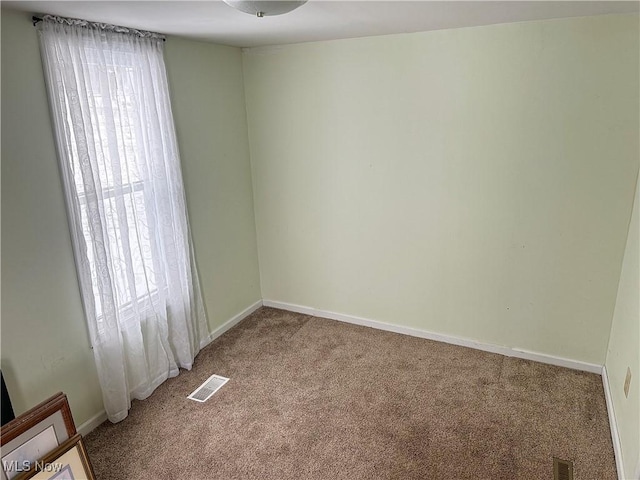 view of carpeted spare room