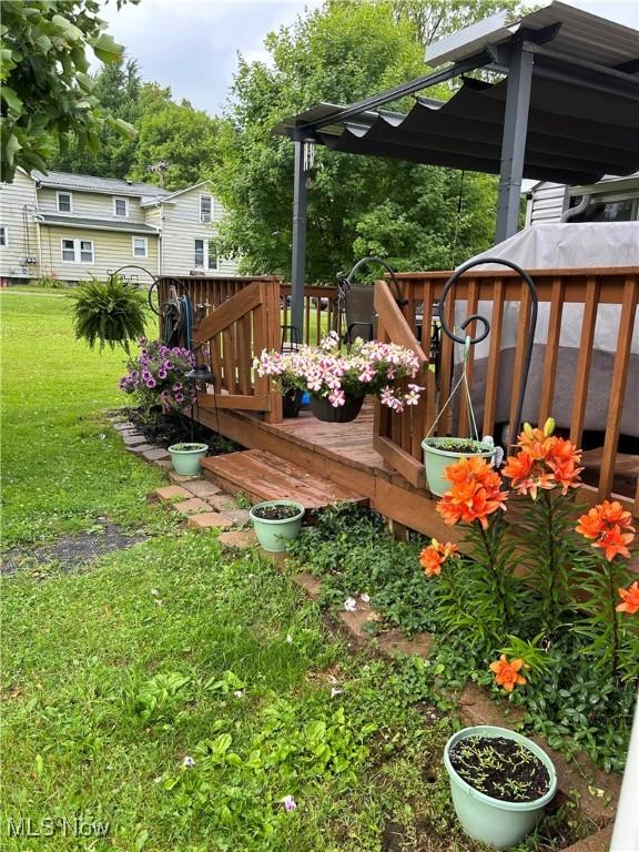 view of yard with a wooden deck