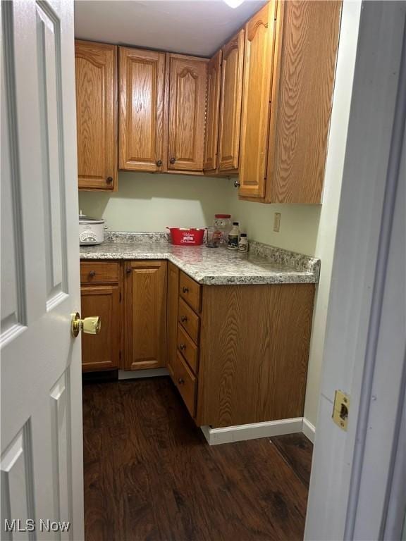 kitchen featuring dark hardwood / wood-style flooring