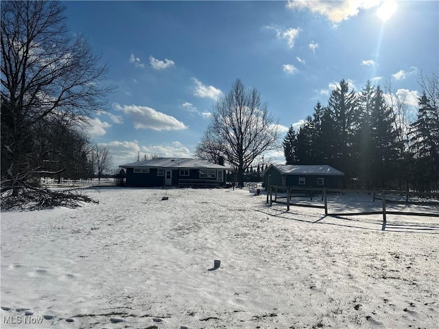 view of yard layered in snow