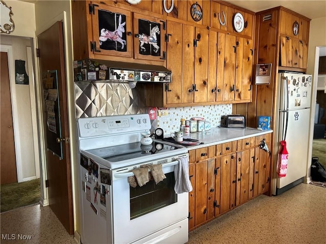 kitchen with tasteful backsplash and white appliances