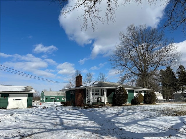 view of front of house with a garage and covered porch