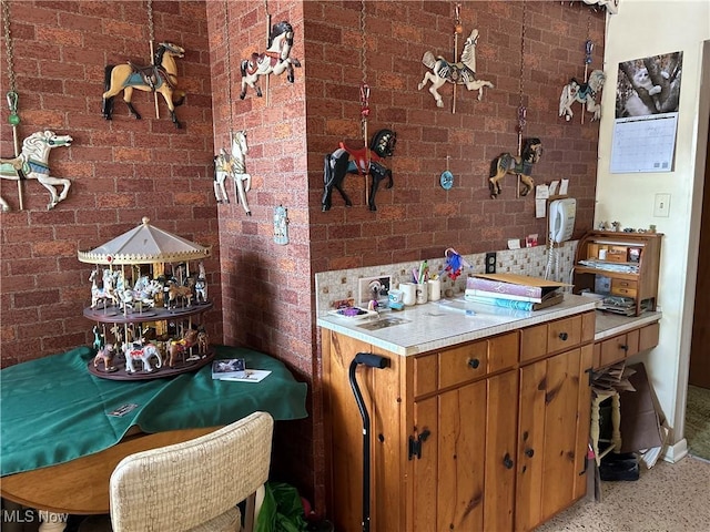 kitchen with brick wall