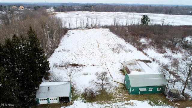 snowy aerial view featuring a rural view