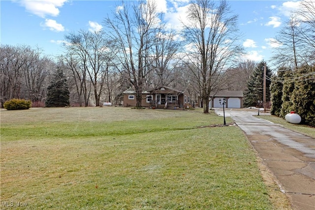 view of front facade featuring a garage and a front lawn