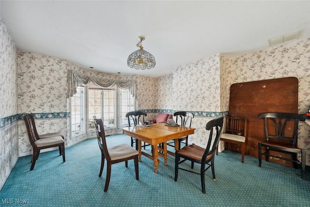 dining space featuring carpet floors