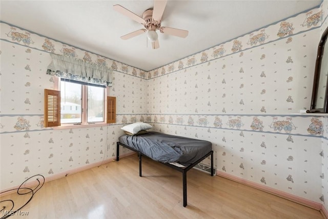 bedroom featuring ceiling fan and light hardwood / wood-style floors