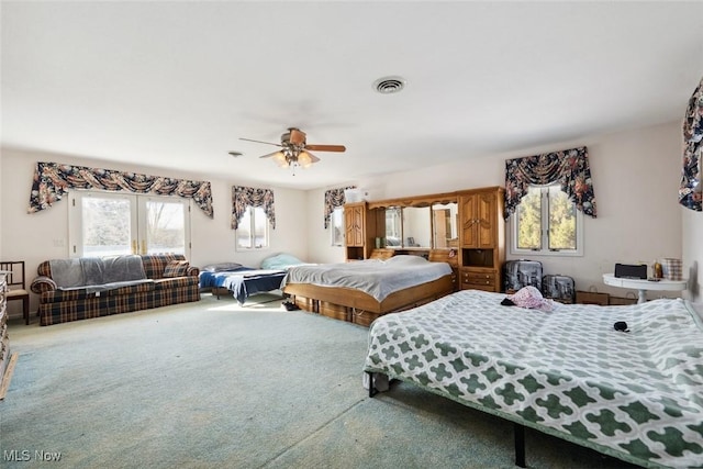 bedroom featuring carpet flooring, access to outside, and ceiling fan