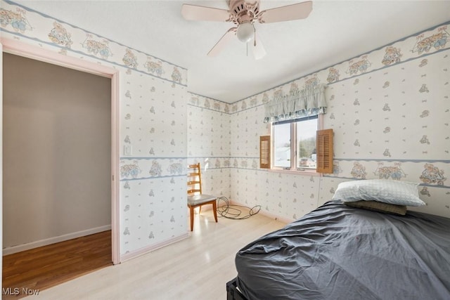 bedroom featuring ceiling fan and wood-type flooring