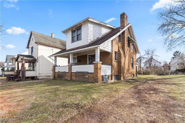 exterior space featuring a porch and a front yard