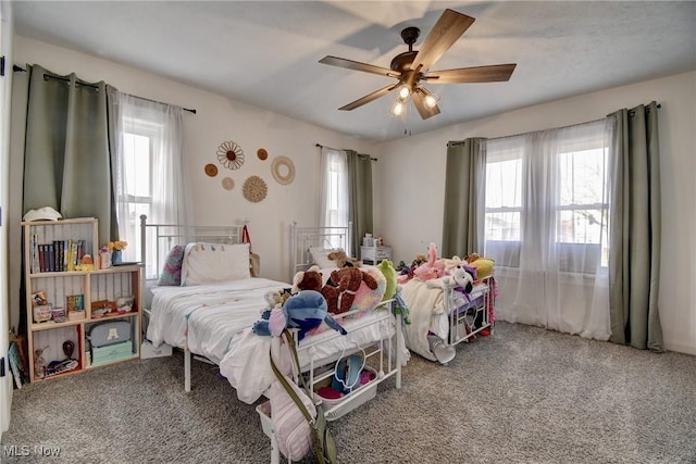 carpeted bedroom featuring ceiling fan