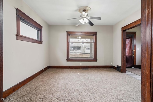 carpeted empty room with ceiling fan