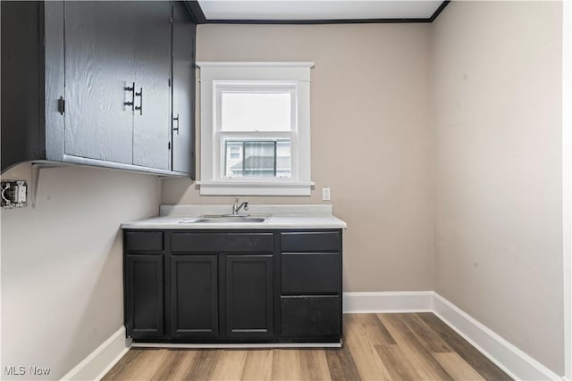 bathroom featuring hardwood / wood-style flooring, vanity, and crown molding