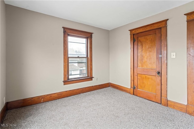 spare room featuring carpet floors