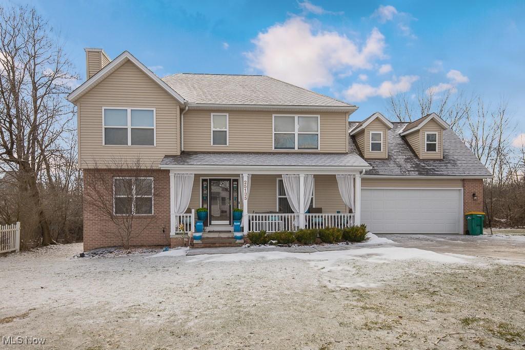 view of front of home with a garage and a porch