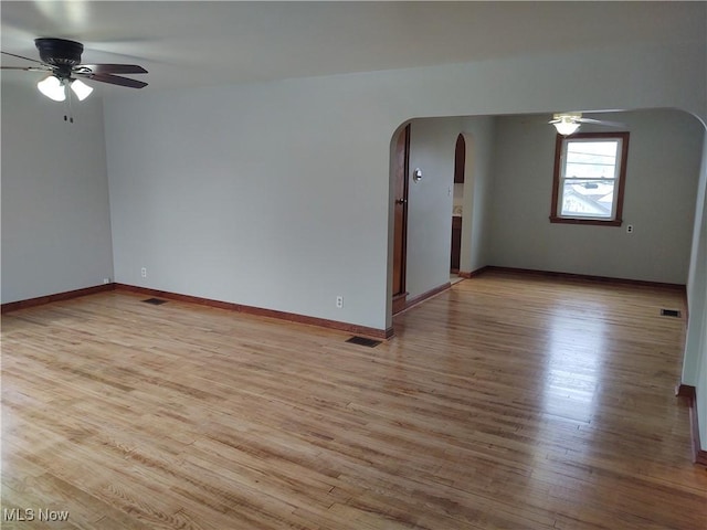 unfurnished room featuring light hardwood / wood-style floors and ceiling fan