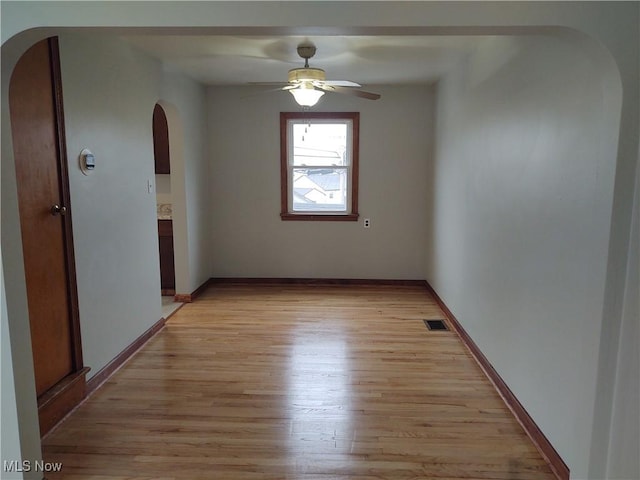 unfurnished room featuring ceiling fan and light hardwood / wood-style floors