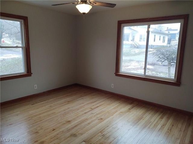 unfurnished room featuring ceiling fan and light wood-type flooring