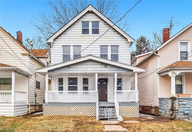 bungalow-style house featuring a front yard and covered porch