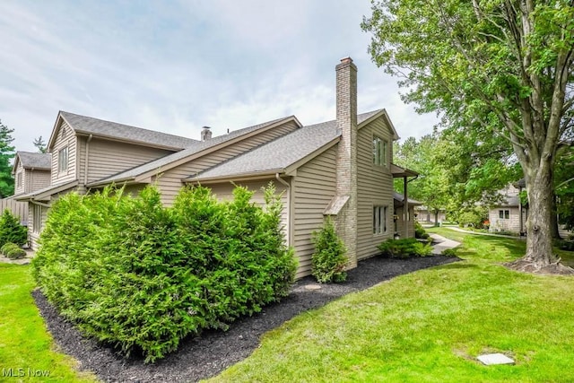 view of home's exterior with a lawn