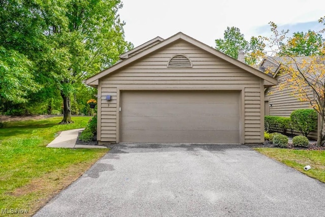 garage featuring a yard