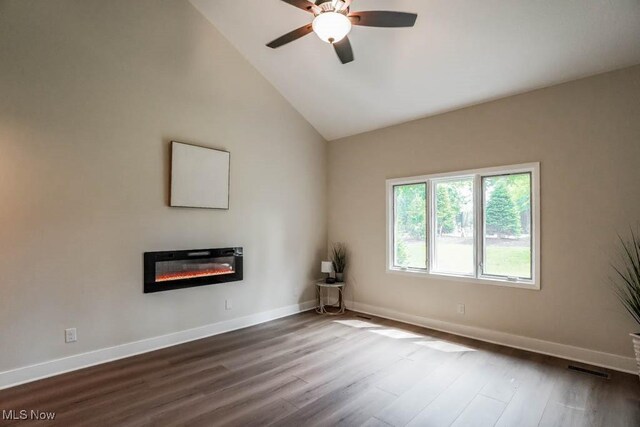 unfurnished living room featuring hardwood / wood-style flooring, ceiling fan, and high vaulted ceiling