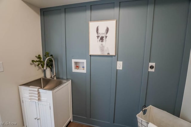 interior space featuring washer hookup, sink, and hookup for an electric dryer