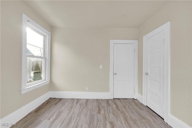 spare room featuring light hardwood / wood-style flooring