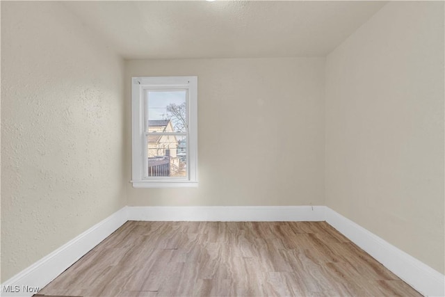 unfurnished room featuring light hardwood / wood-style flooring