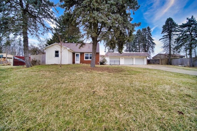 view of front of home featuring a garage and a front lawn