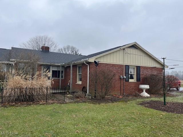 view of property exterior featuring a lawn