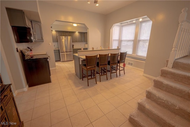 dining space featuring light tile patterned floors