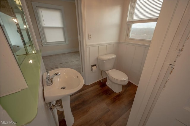 bathroom featuring sink, hardwood / wood-style floors, and toilet