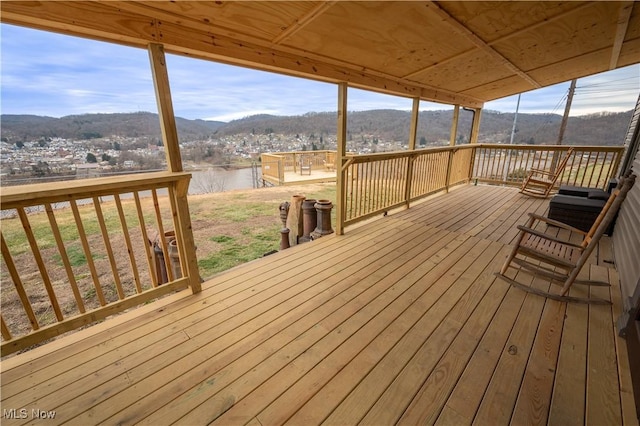 wooden deck featuring a mountain view