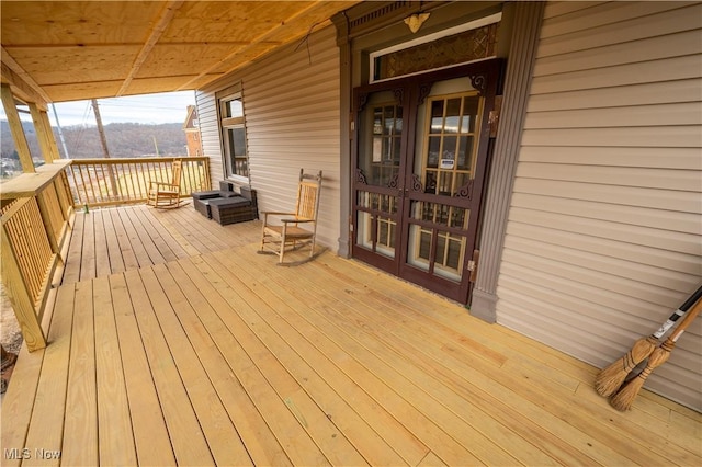 wooden terrace featuring french doors