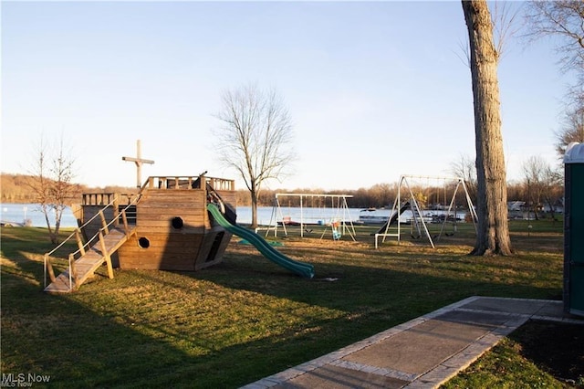 view of play area featuring a water view and a yard