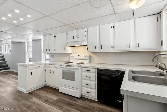 kitchen with white electric stove, under cabinet range hood, white cabinetry, black dishwasher, and light countertops