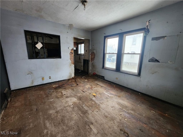 interior space featuring a textured ceiling