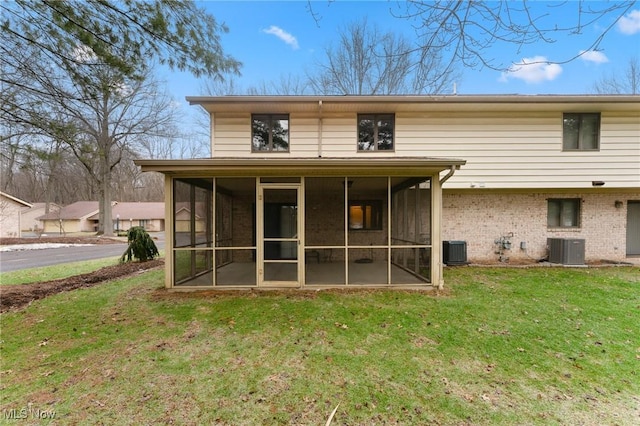 1260 Boardman-Canfield Rd # 29, Boardman, OH 44512 - rear view of house featuring a yard, a sunroom, and central air condition unit